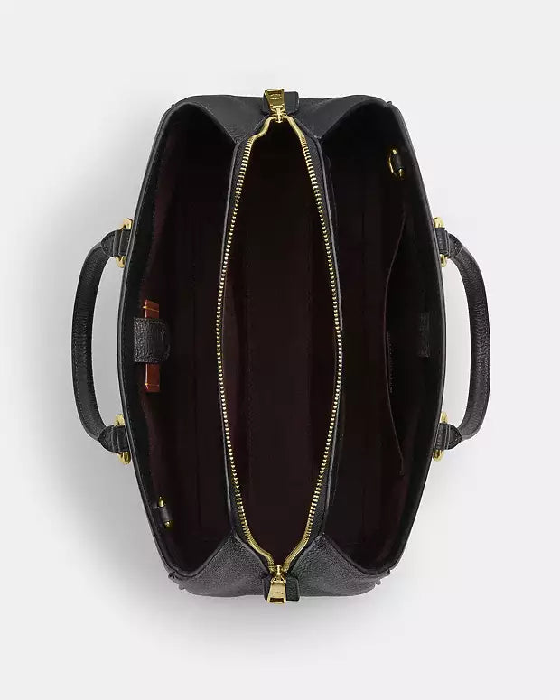 Bolso de mano Coach con etiqueta Coach