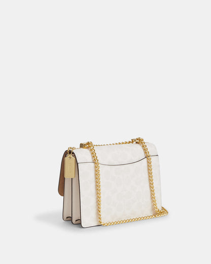 Bolsa Coach con asa superior
